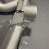 Close-up of reinforced BMW E39 M5 rear subframe with TIG-welded front differential mount and silver powdercoat finish