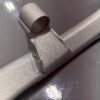 Reinforced front subframe tab on E39 M5 rear subframe with TIG welds and metallic silver powdercoat